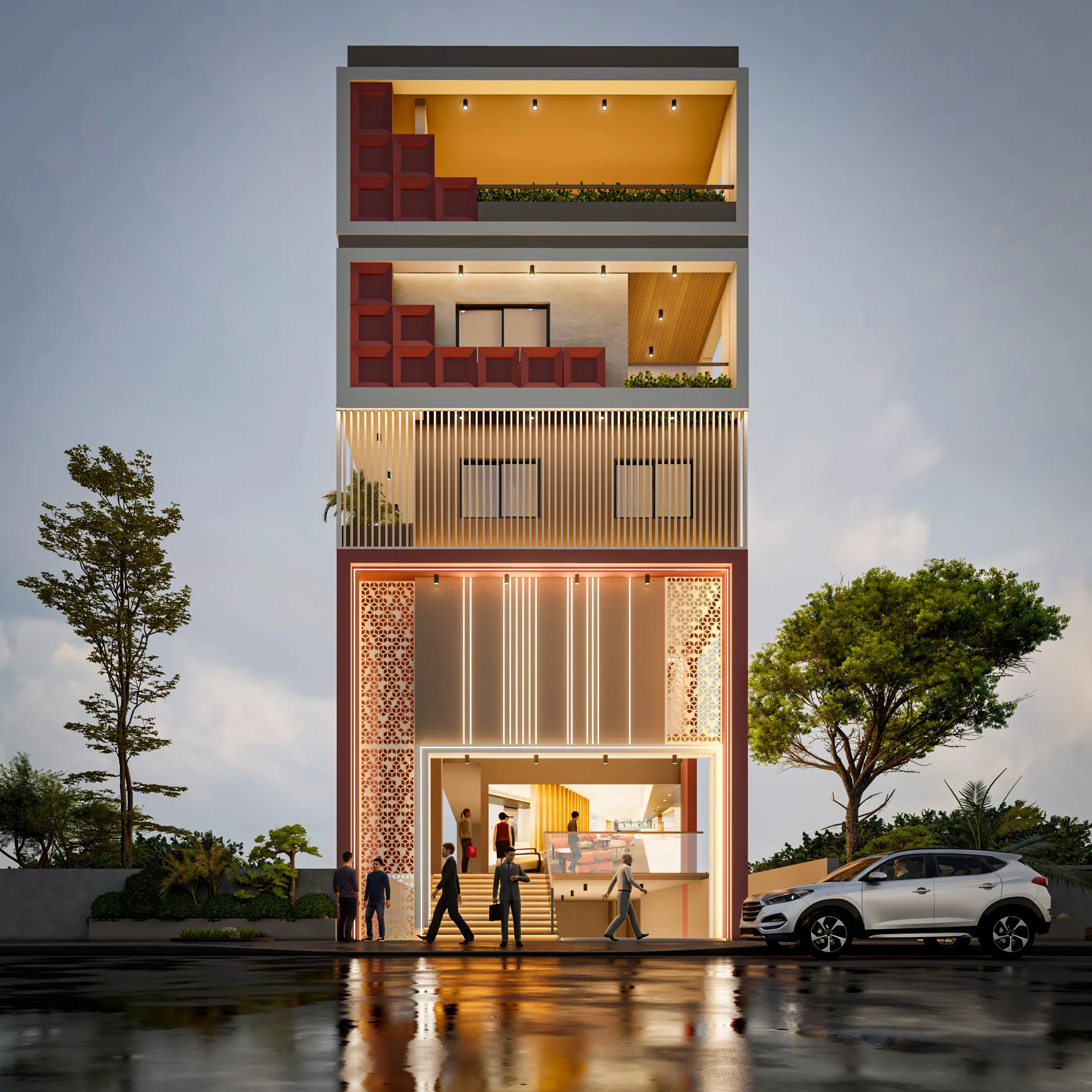 Narrow showroom facade with a lit jaali screen and red panels