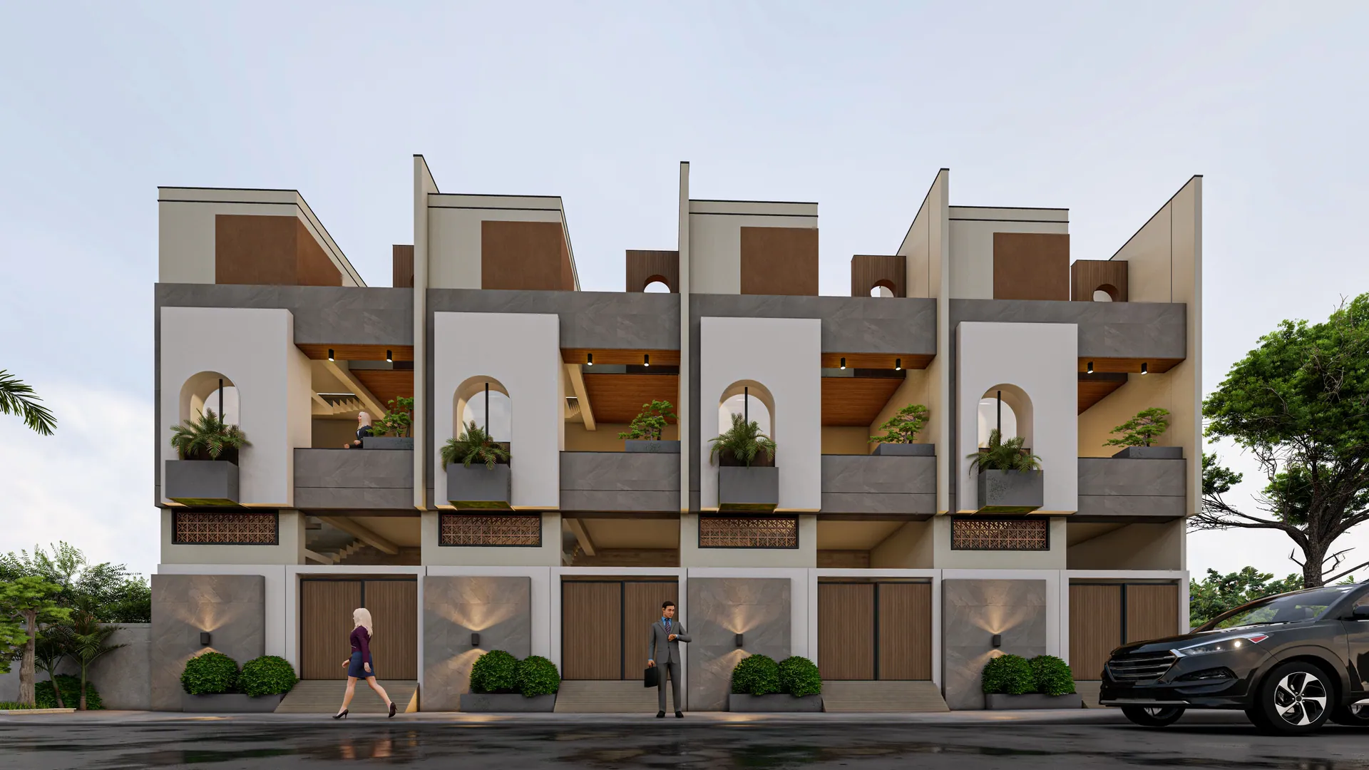 Row of three-storey row houses with arched balconies and planters